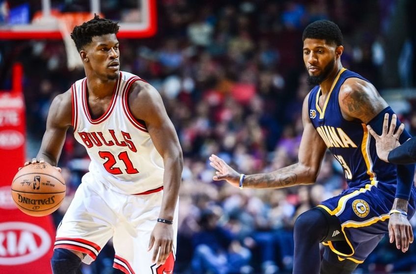 Oct 29, 2016; Chicago, IL, USA; Chicago Bulls guard Jimmy Butler (21) controls the ball as Indiana Pacers forward Paul George (13) defends during the first half at United Center. The Bulls won 118-101. Mandatory Credit: Jeffrey Becker-USA TODAY Sports